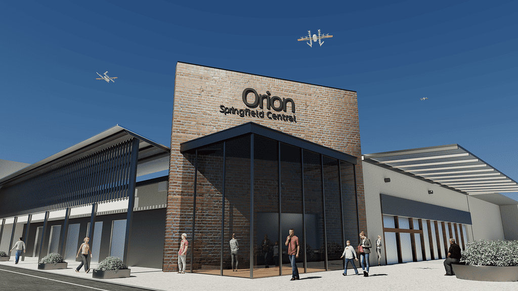 Wing drones flying out from the Orion shopping centre rooftop in Springfield Central